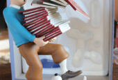 Tintin tenant des albums